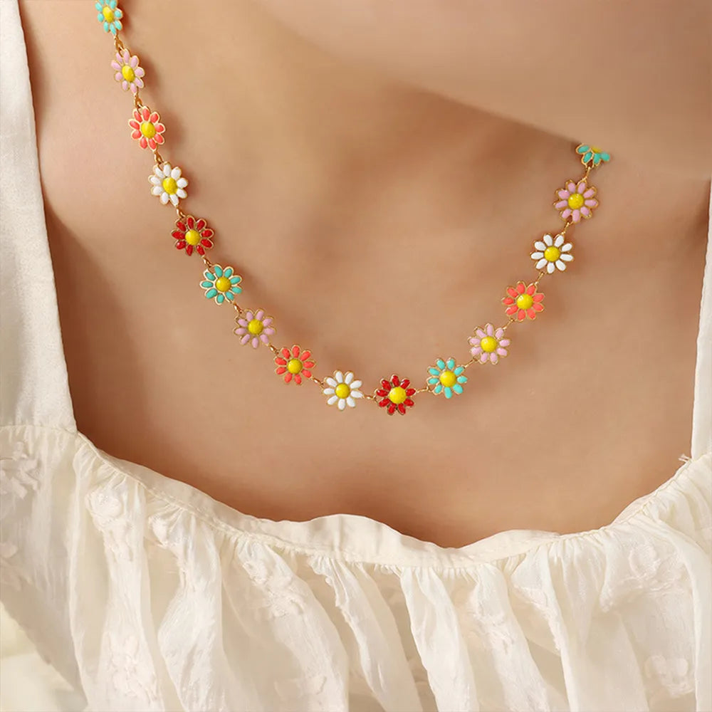 Collar de flor con gotas de aceite de acero de titanio
