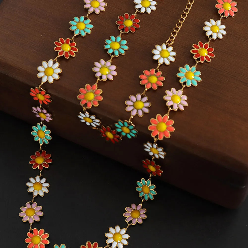 Collar de flor con gotas de aceite de acero de titanio